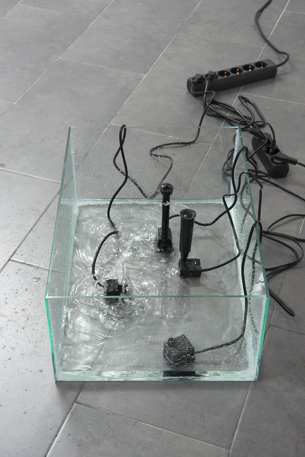 Jutta ZimmermannUntitled, 2013Glass, fountains, water, multi-contact plug, extension cable45 x 30 x 28 cm