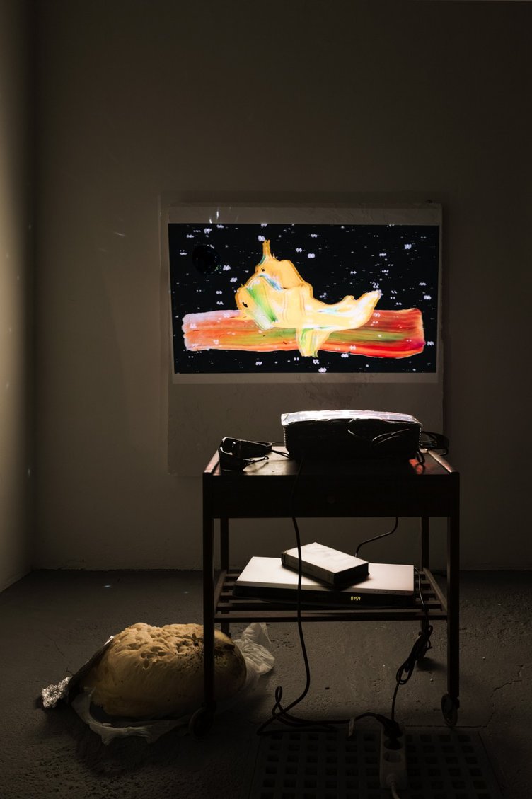 Trisha BagaWerner Eats His Shoe, 20132D projection on glow-in-the-dark-paint and 3D projection on foam panel with sparkle, paint and half disco ballFormat variable