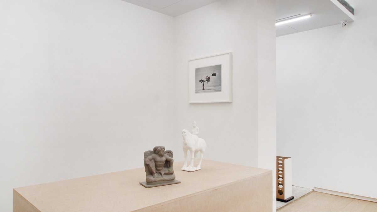 Daily Pictures, Taipei City, Taiwan, 2023Installation View, From left: Gaylen Gerber, Support, n.d. oil paint on grey schist relief of a youthful winged Atlas, Greco-Bactria, Gandhara (north-west Pakistan and southeast Afghanistan), on base, 2nd-3rd century CE, 18.3 x 17.8 x 9 cm (7¼ x 7 x 3½ inches); Gaylen Gerber, Support, n.d., oil paint on horse and rider, China, earthenware with three color (sancai) glaze and pigment, Tang dynasty 618 - 907 CE, 29.5 x 23.7 x 11.4 cm (11½ x 9¼ x 4½ inches); Peter Fischli and David Weiss, Blossoming Branch, 1986, c-print, 30 x 40 cm (12 x 16 inches), Ed. 1 of 3; Max Guy, Appareil Photo (#1), 2020, foam board, cork, bookbinding board, paper packing tape on Epson Perfection V39 Scanner, overall dimensions variable with installation