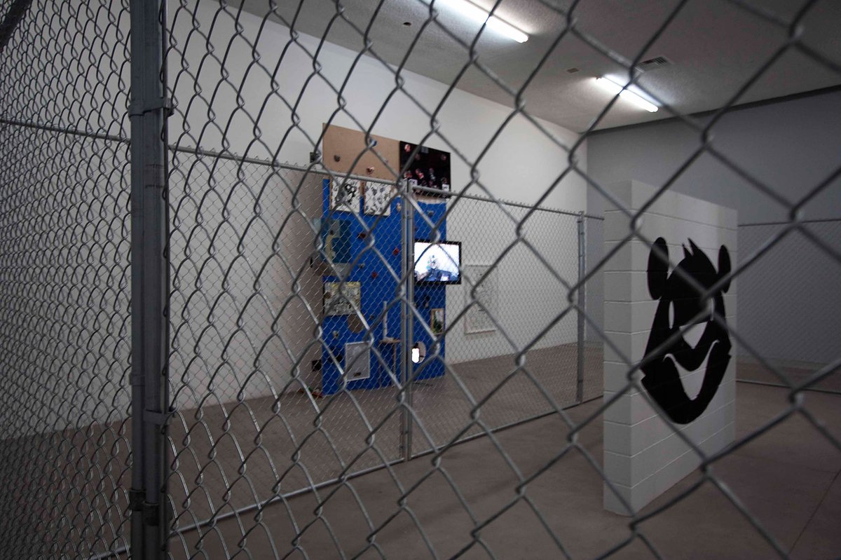 Support Group, 2010Installation view: Mateo Tannatt, Monster model: Blue Screen Version, 2010, steel, wood, paint, hardware, DVD, video projector, dimensions vary with installation; Kathryn Andrews, Friends and Lovers, 2010, chain link fence, concrete, paint, 7.31 x 10.5 (288 x 396 x 96 in.); latex paint, transparent lighting gels, overall dimensions vary with installationThomas Solomon Gallery at Cottage Home, Los Angeles
