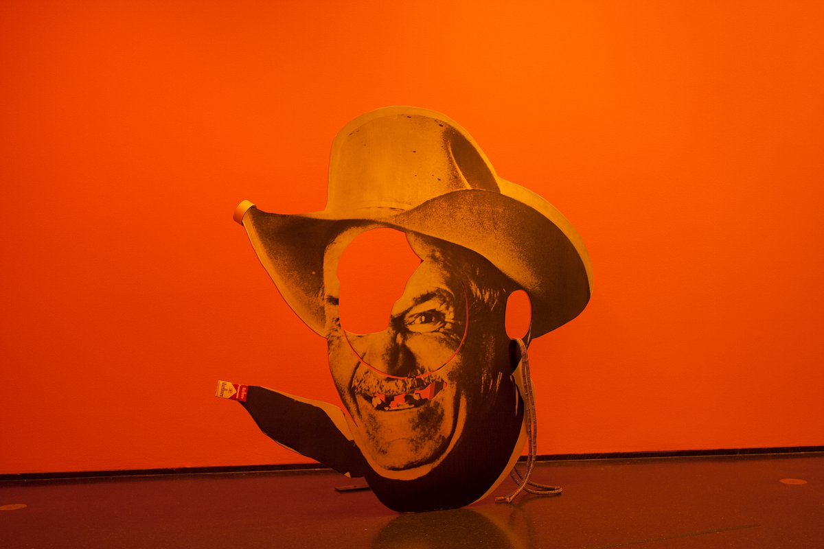 Gaylen Gerber, 2013Installation view: Cady Noland, Chainsaw Cut Cowboy Head, 1990, silkscreen on aluminum with rope, roll of tape, and cigarette box, 152.4 x 152.4 x 49 cm, (60 x 60 x 19 1/4 inches)Museum of Contemporary Art, Chicago