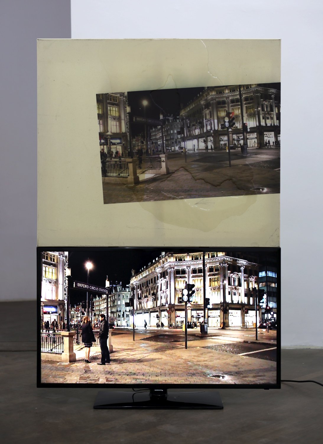 Philipp TimischlYet, The Alternatives On Offer, 2014UV-direct print on epoxy resin on canvas above flatscreen, video 00:02:00159 x 105 x 5 cm